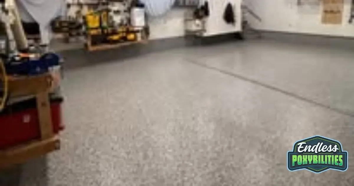 A concrete coated light gray speckled basement epoxy floor.