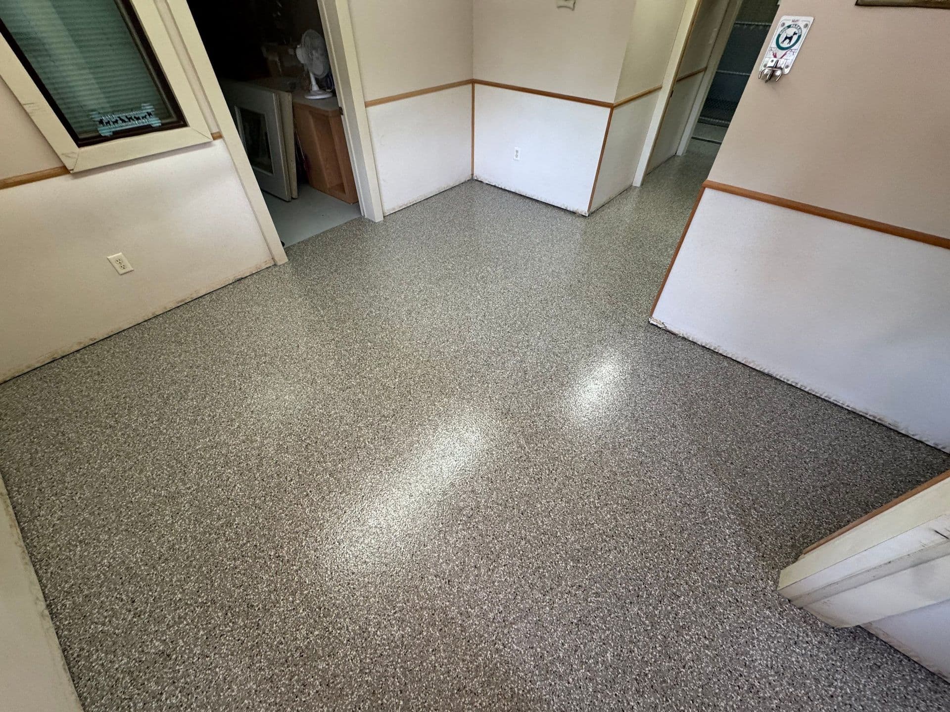 An office space with newly-coated Polyurea flake flooring.