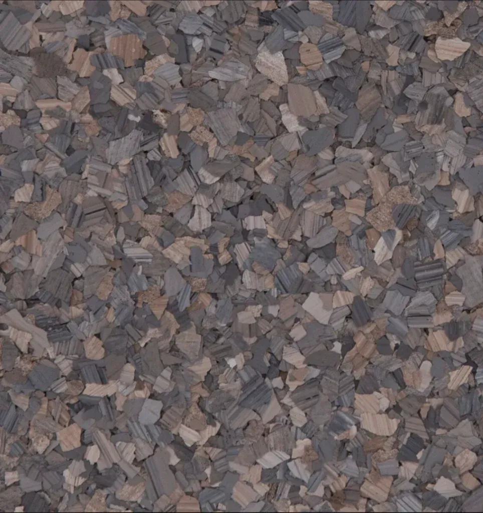 A swatch for flake flooring in the color Dolerite.