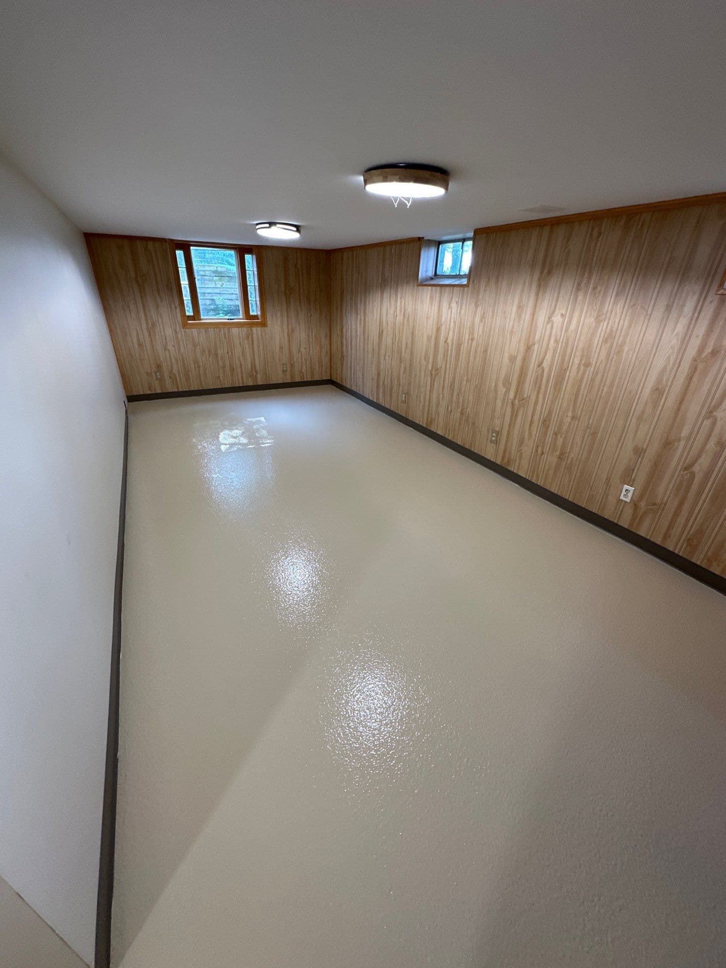 Newly-coated solid color concrete flooring.